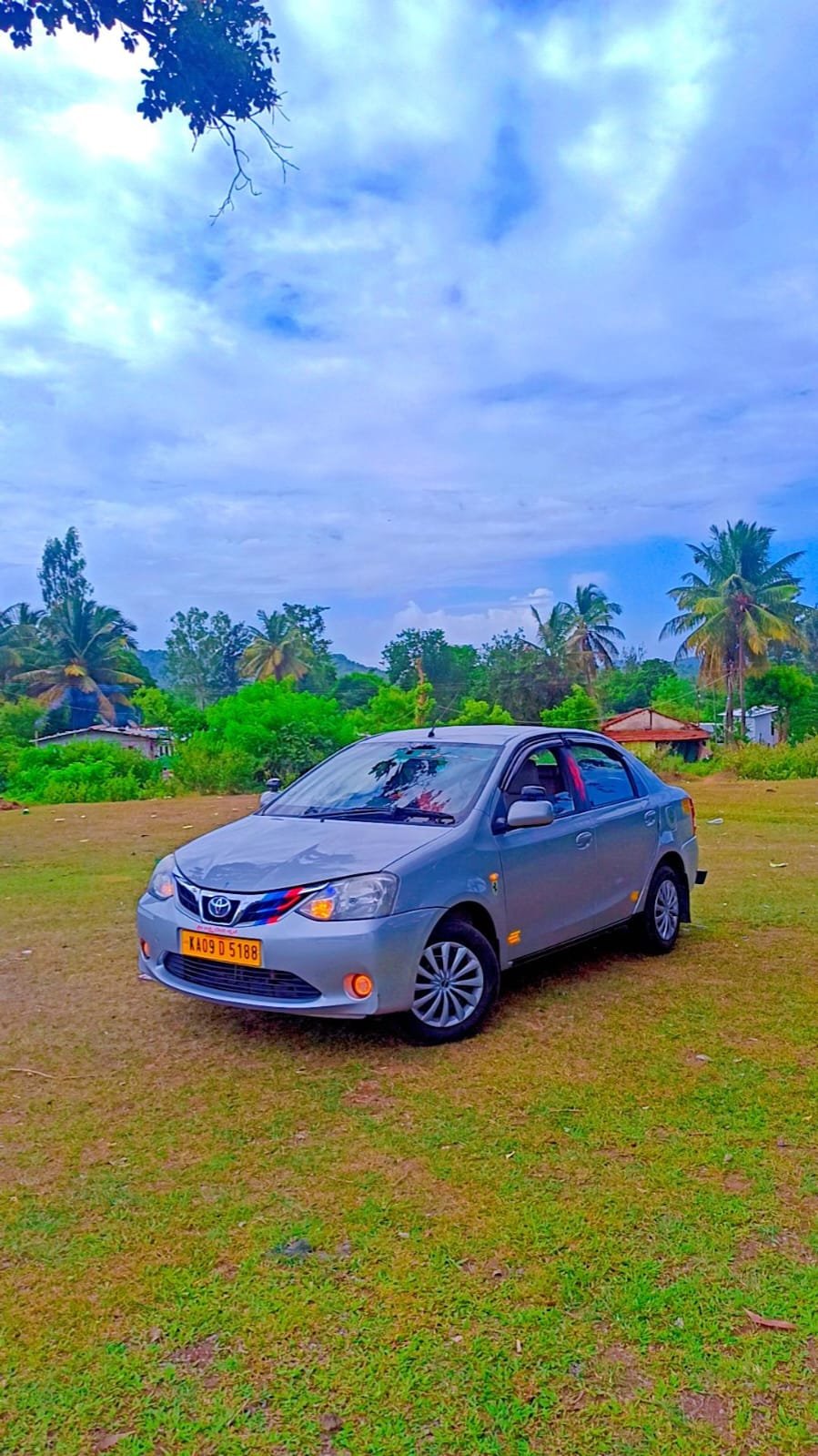 Toyota Etios silver sedan budget cab side profile